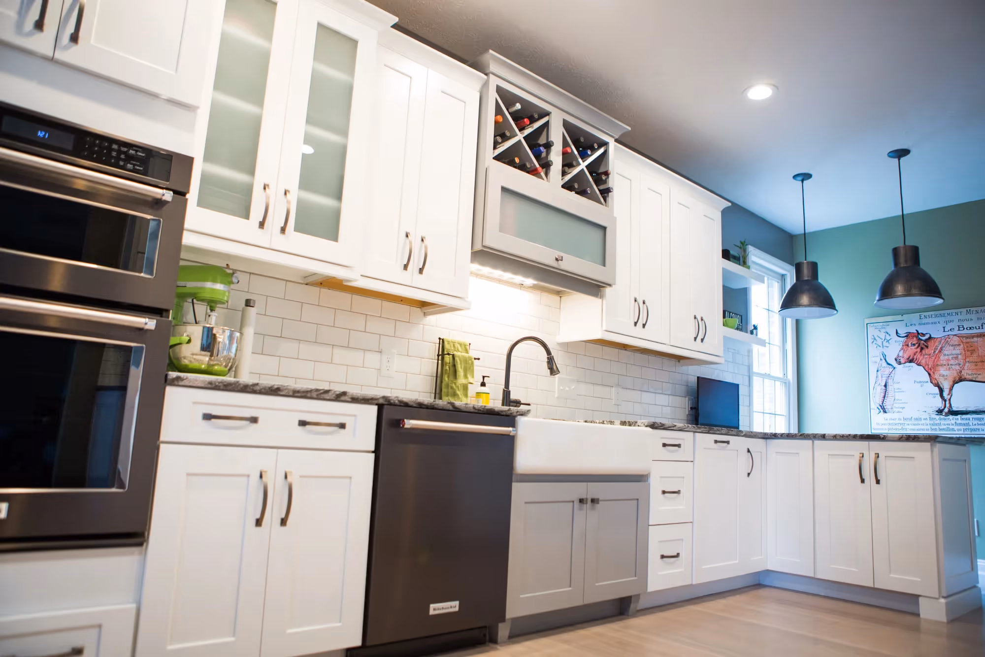 Kitchen with double ovens and white cabinets