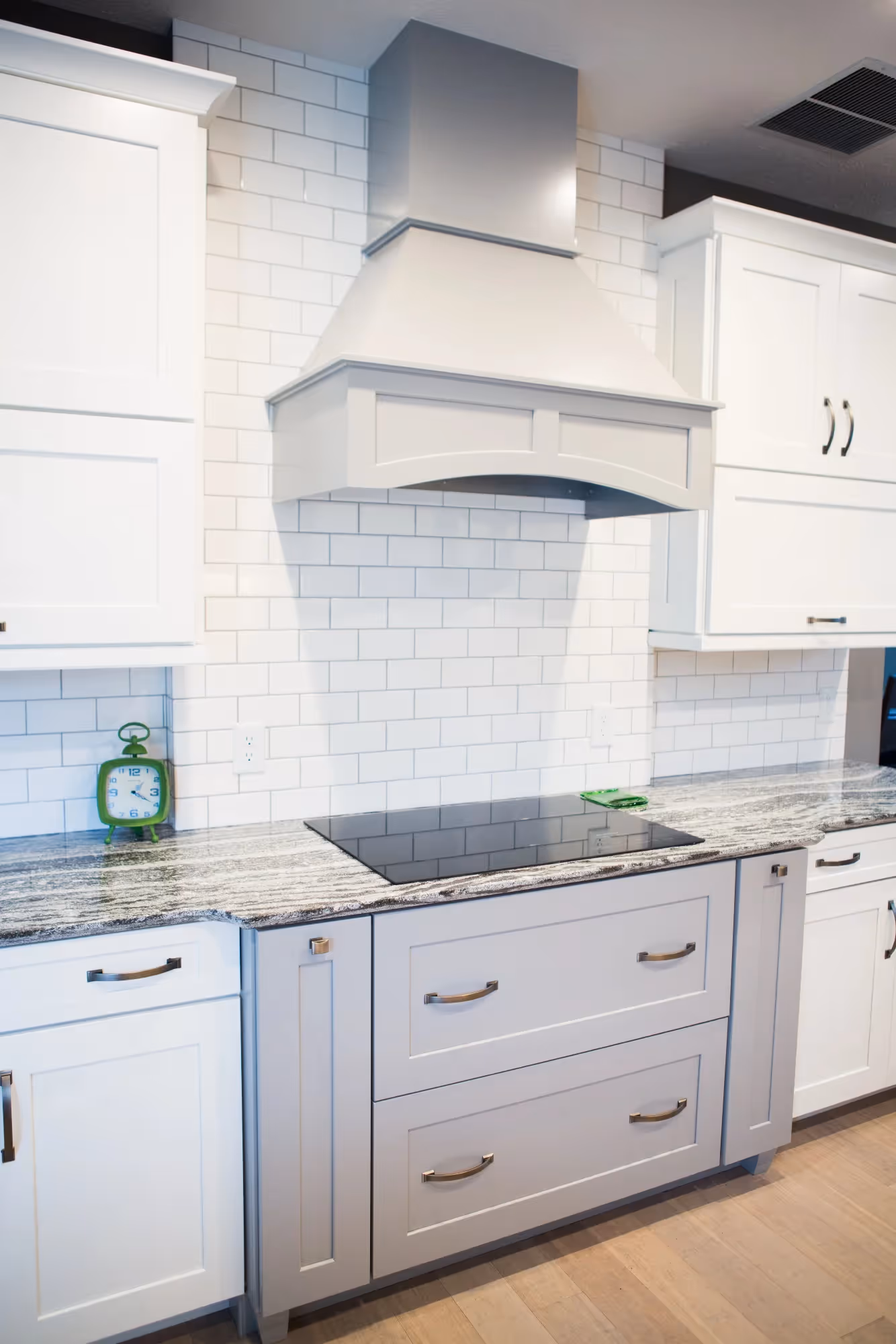 White kitchen with cabinets and oven