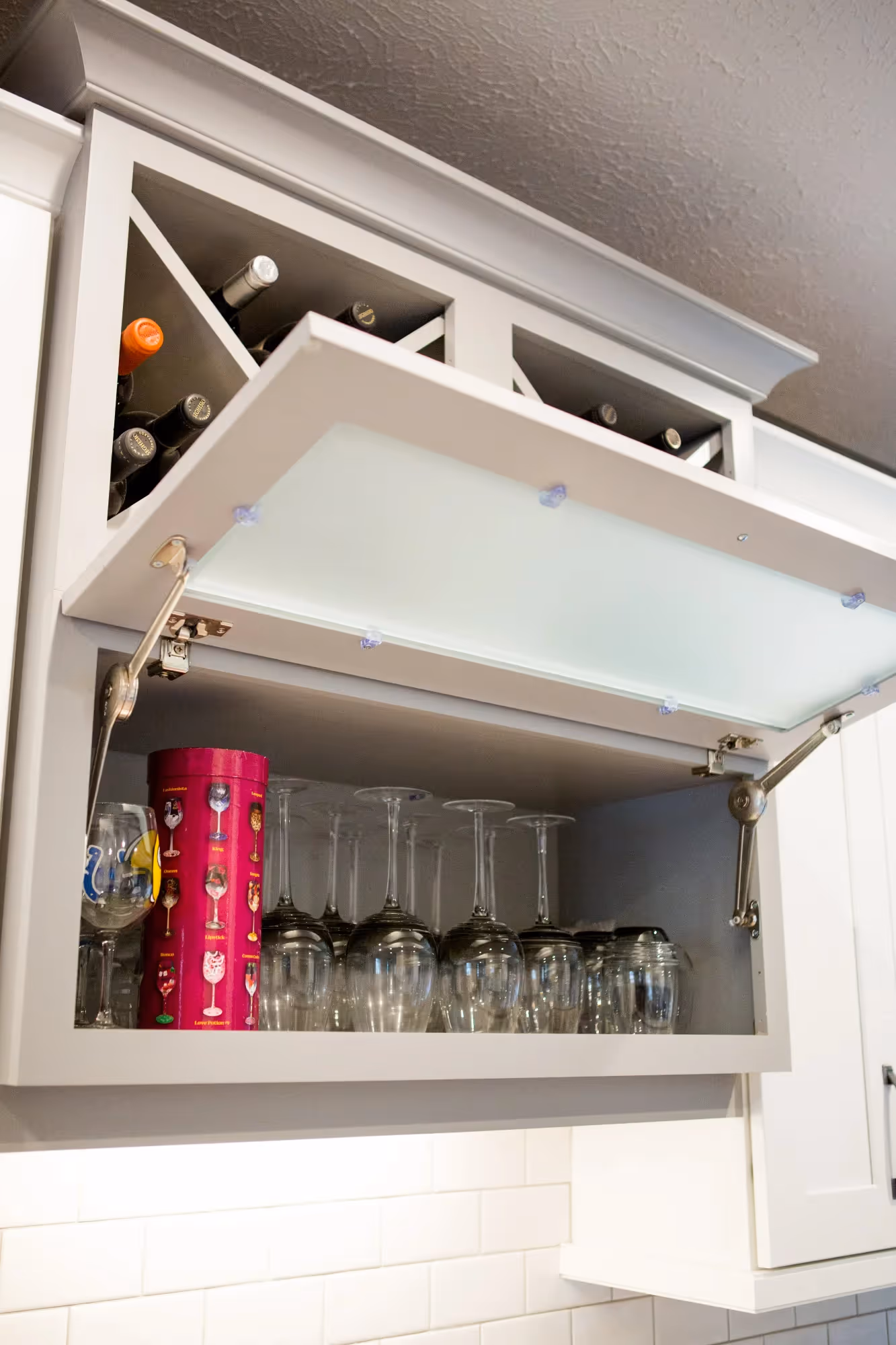 Pull-out cabinet organizer with wine bottles
