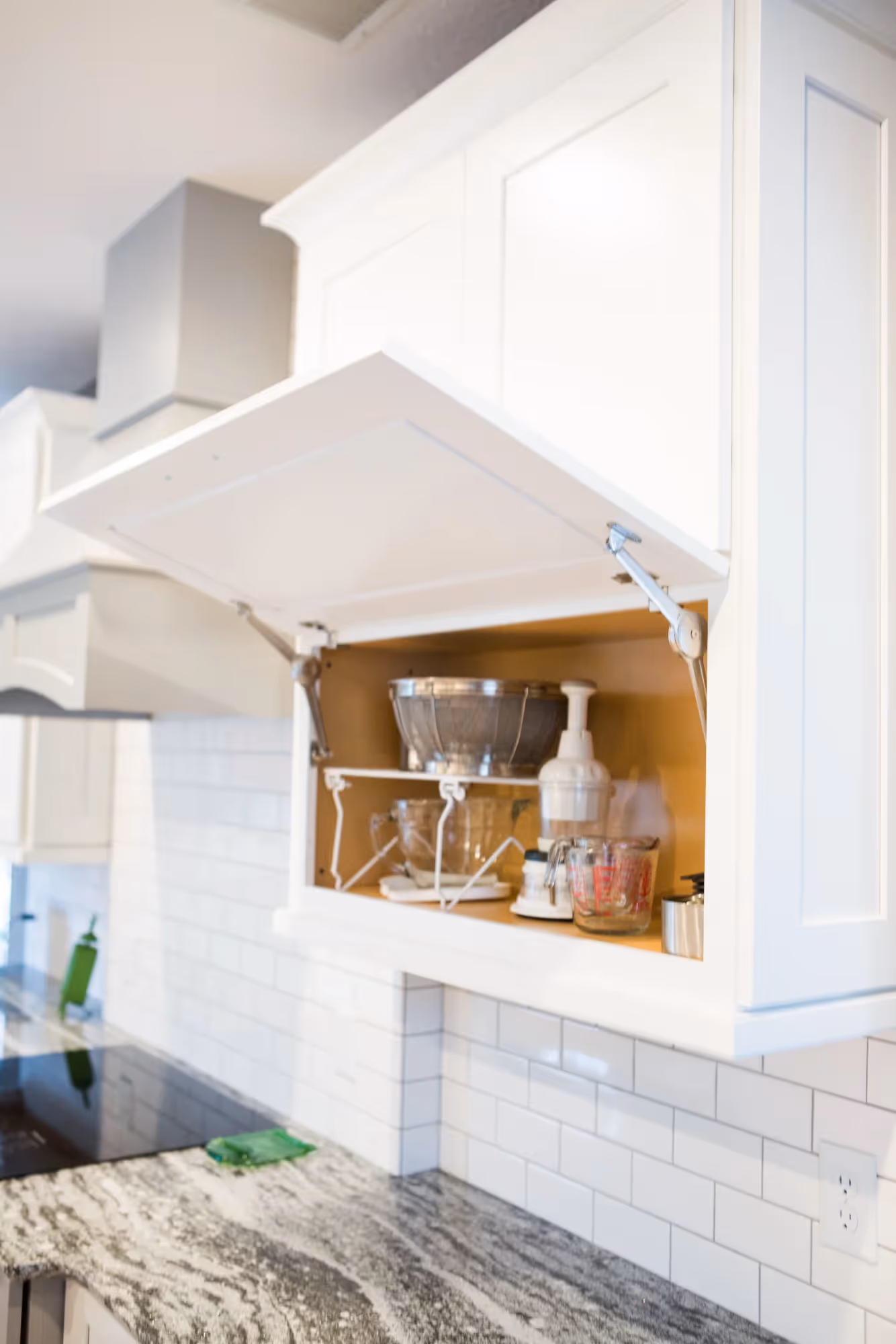 Bright white kitchen with island and wood floors