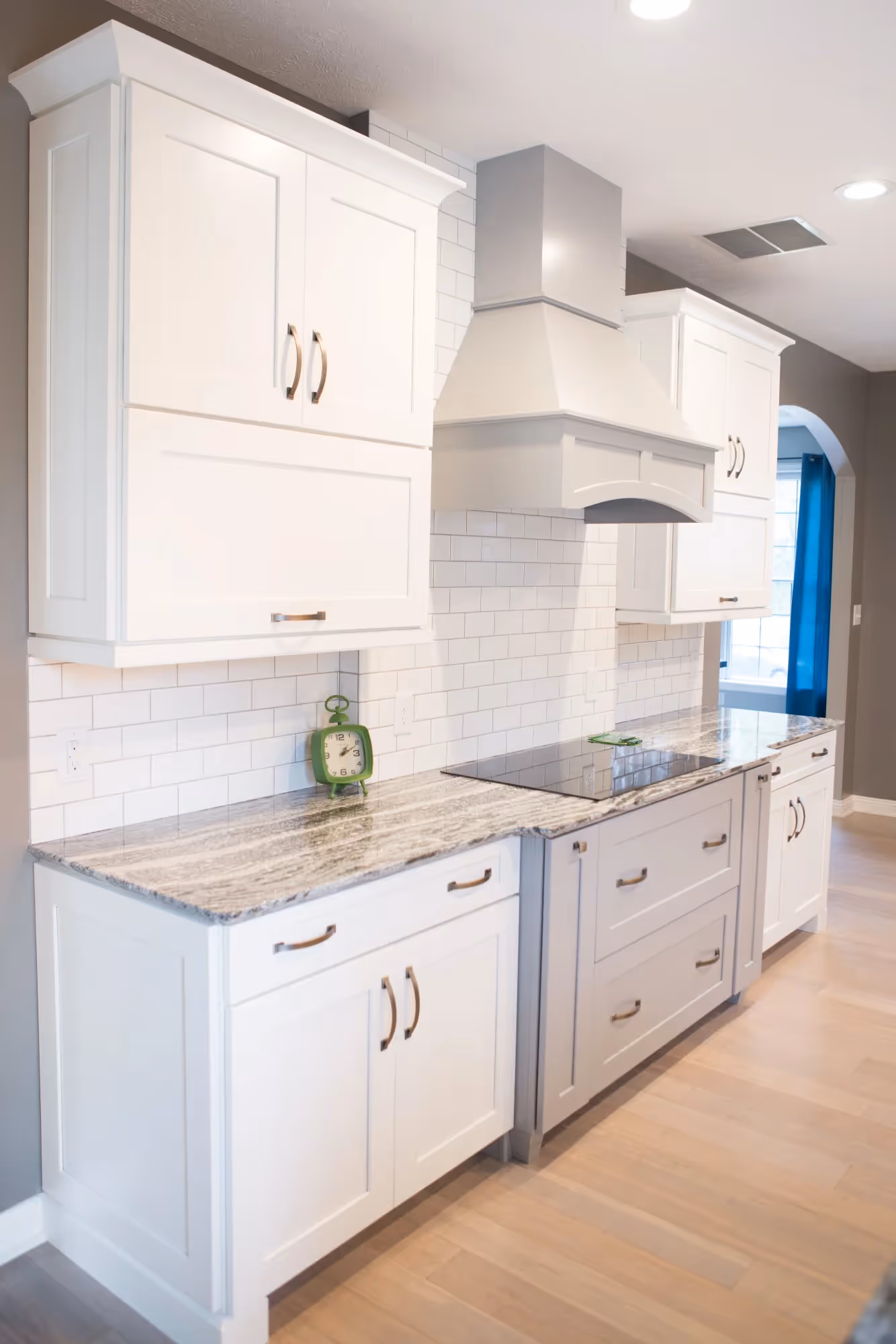 White kitchen with sink and cabinets