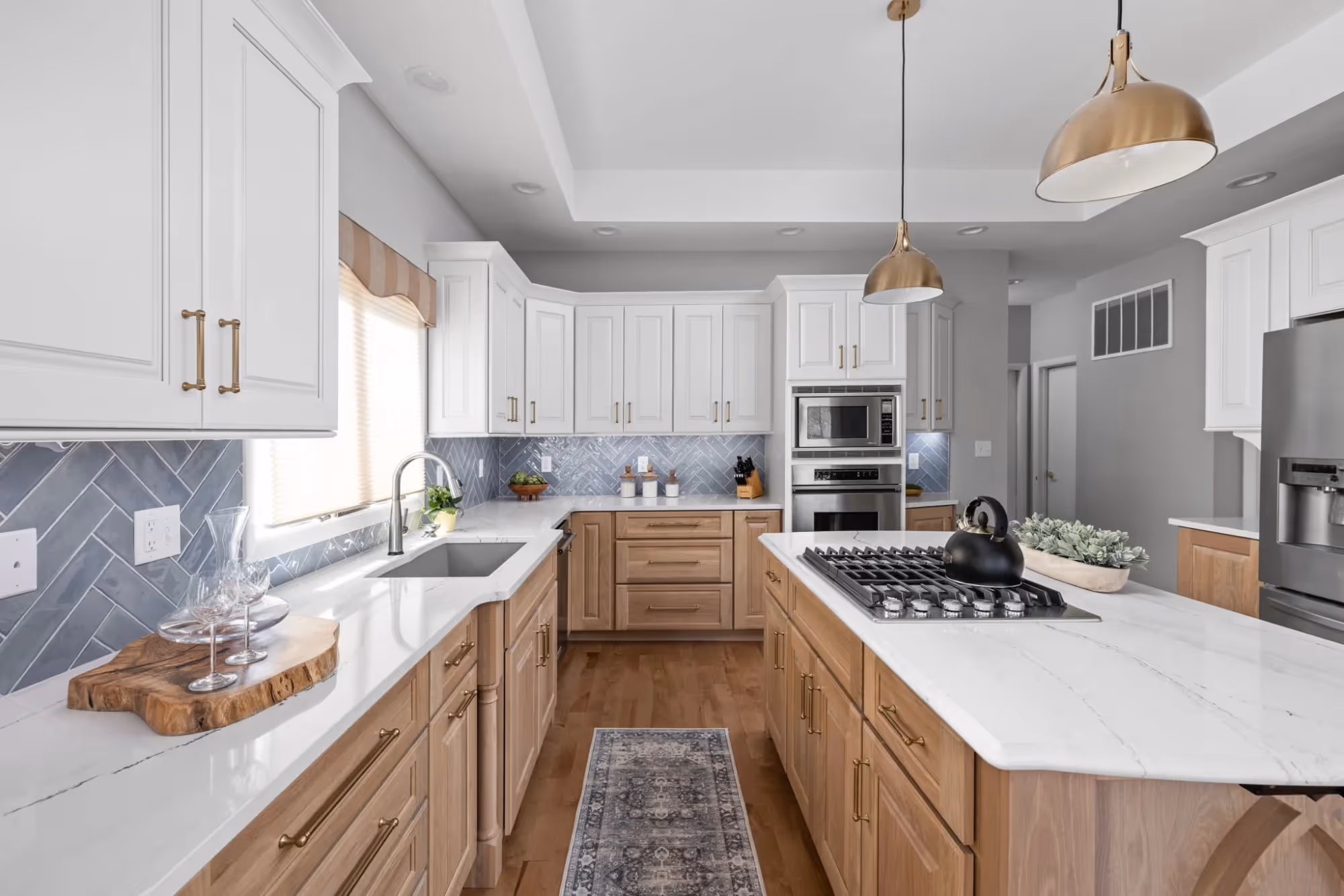 Bright kitchen with wood cabinets and island