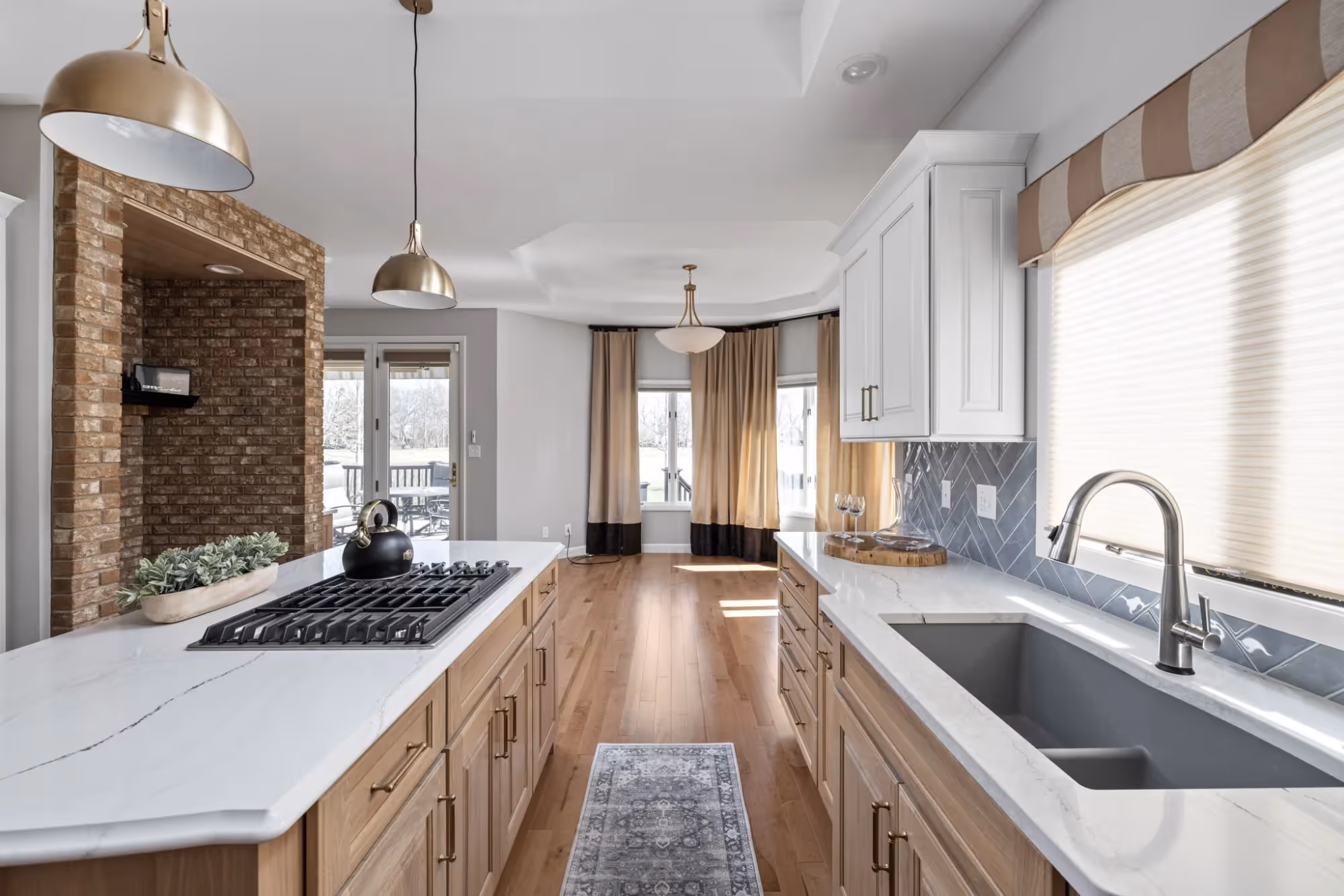 Modern kitchen with large island and windows