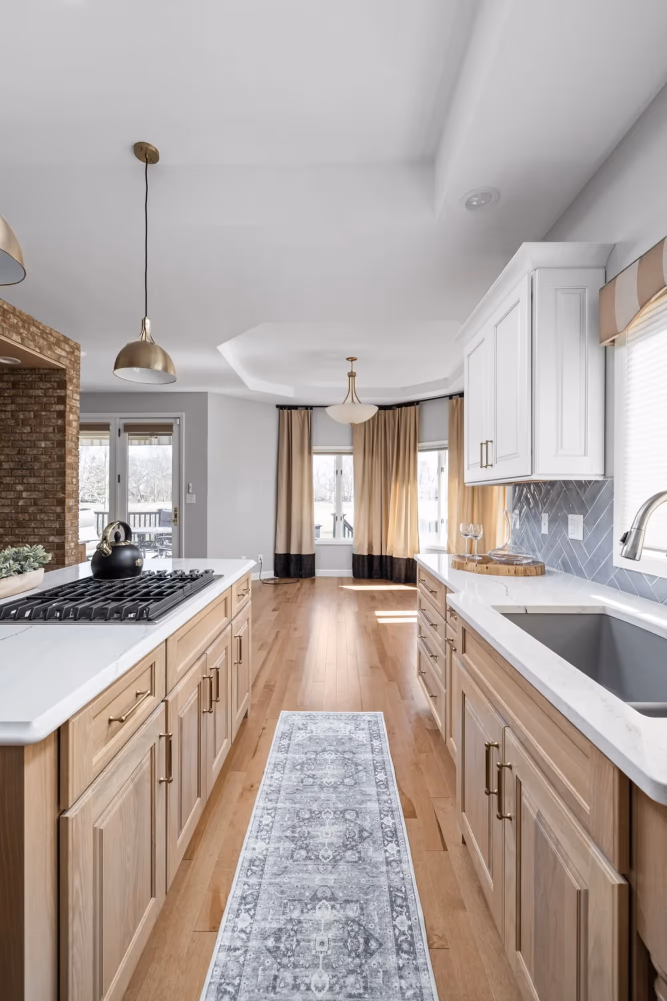 Long galley kitchen with wood floors