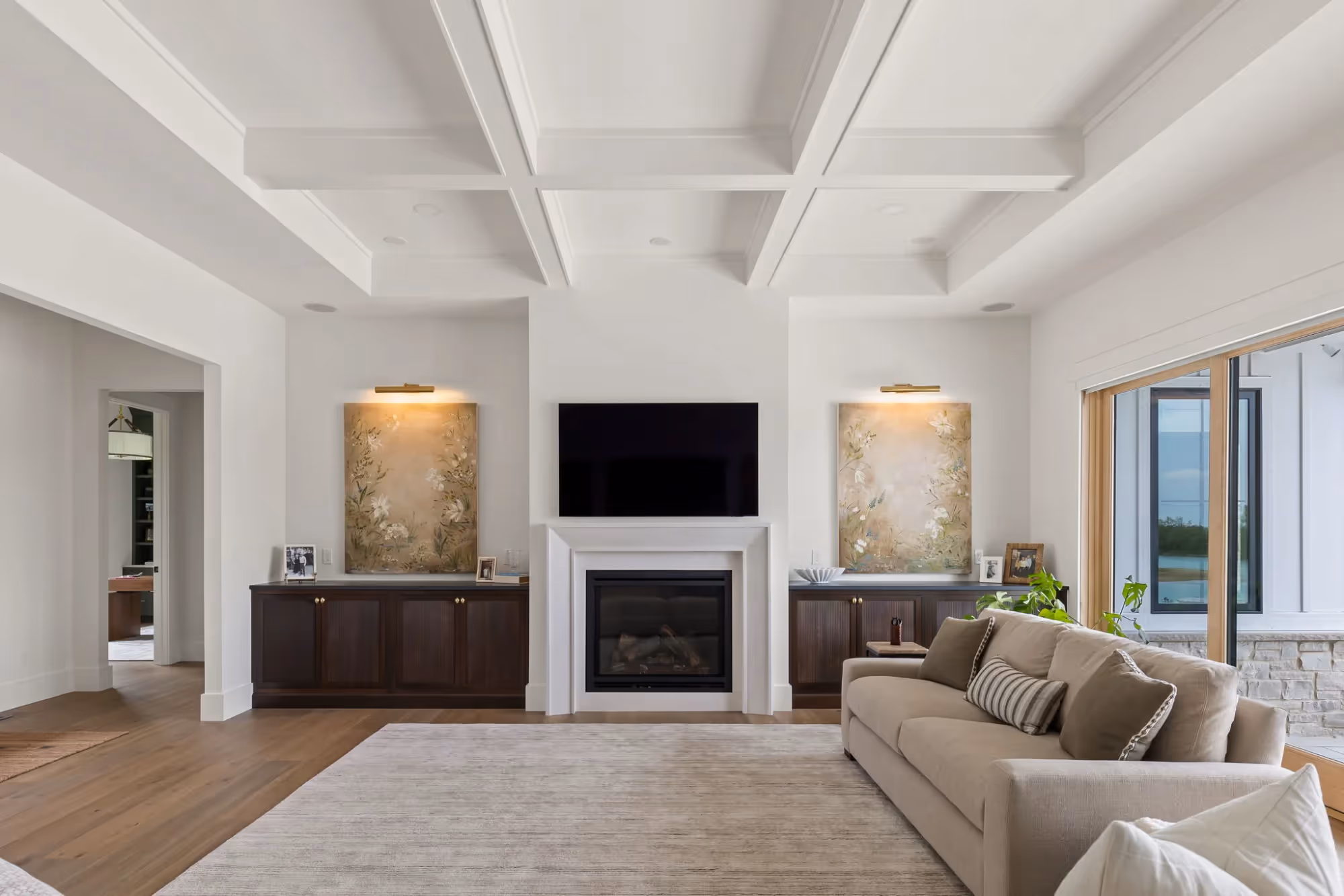 Spacious living room with sectional sofa and TV.