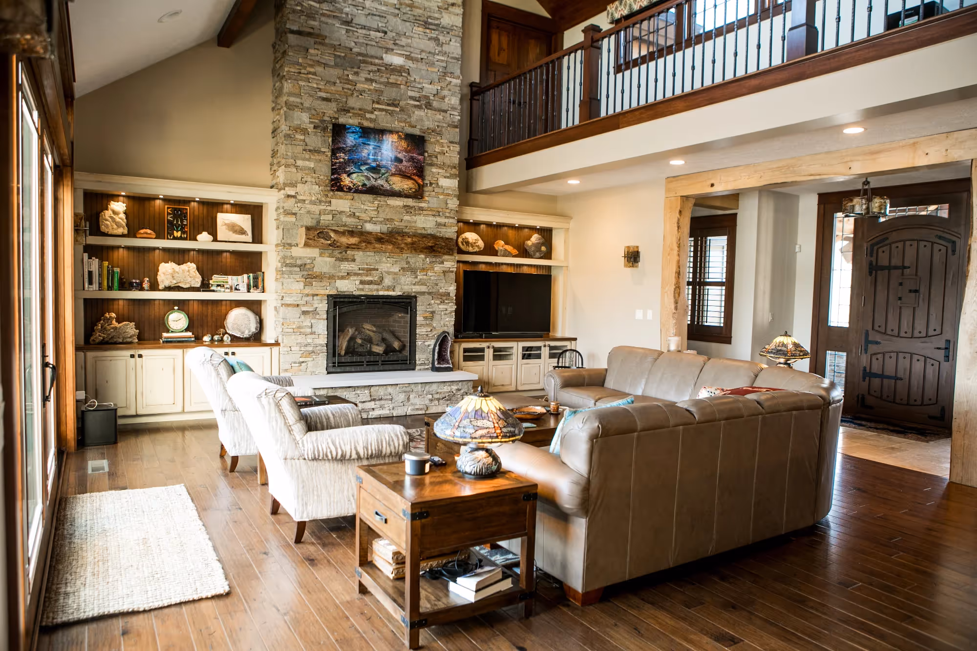 Living room with built-in bar area and open shelving.