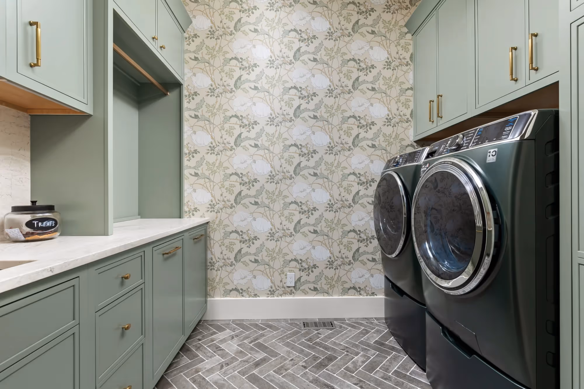 Laundry room with washer-dryer and storage cabinets