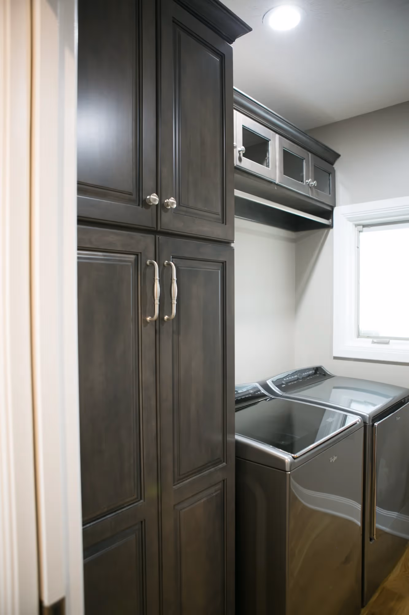 Compact kitchenette with dark cabinetry