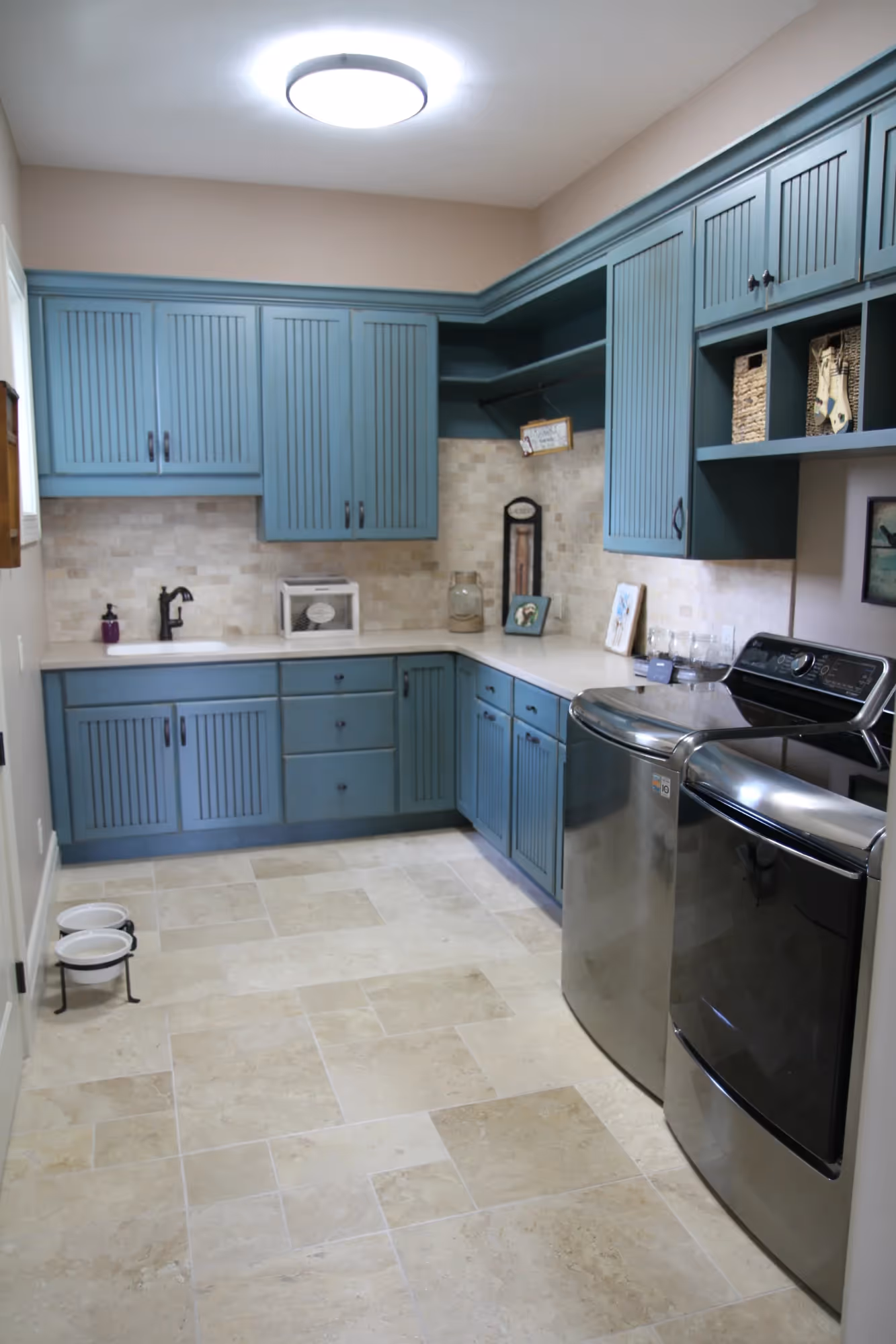 Blue-toned kitchen with modern cabinetry and appliances