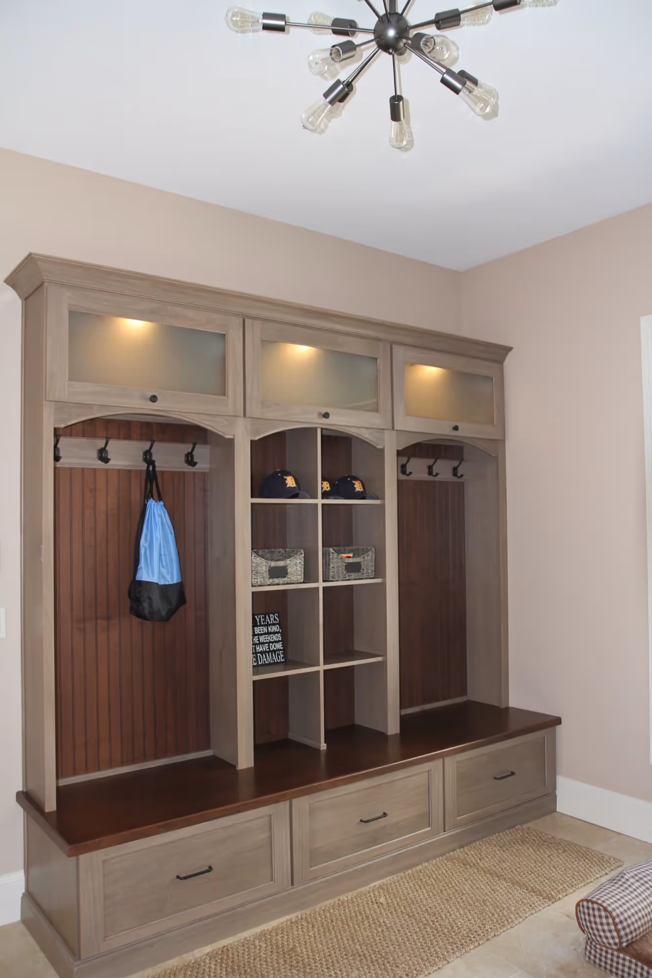 Entry hallway with built-in storage and lighting