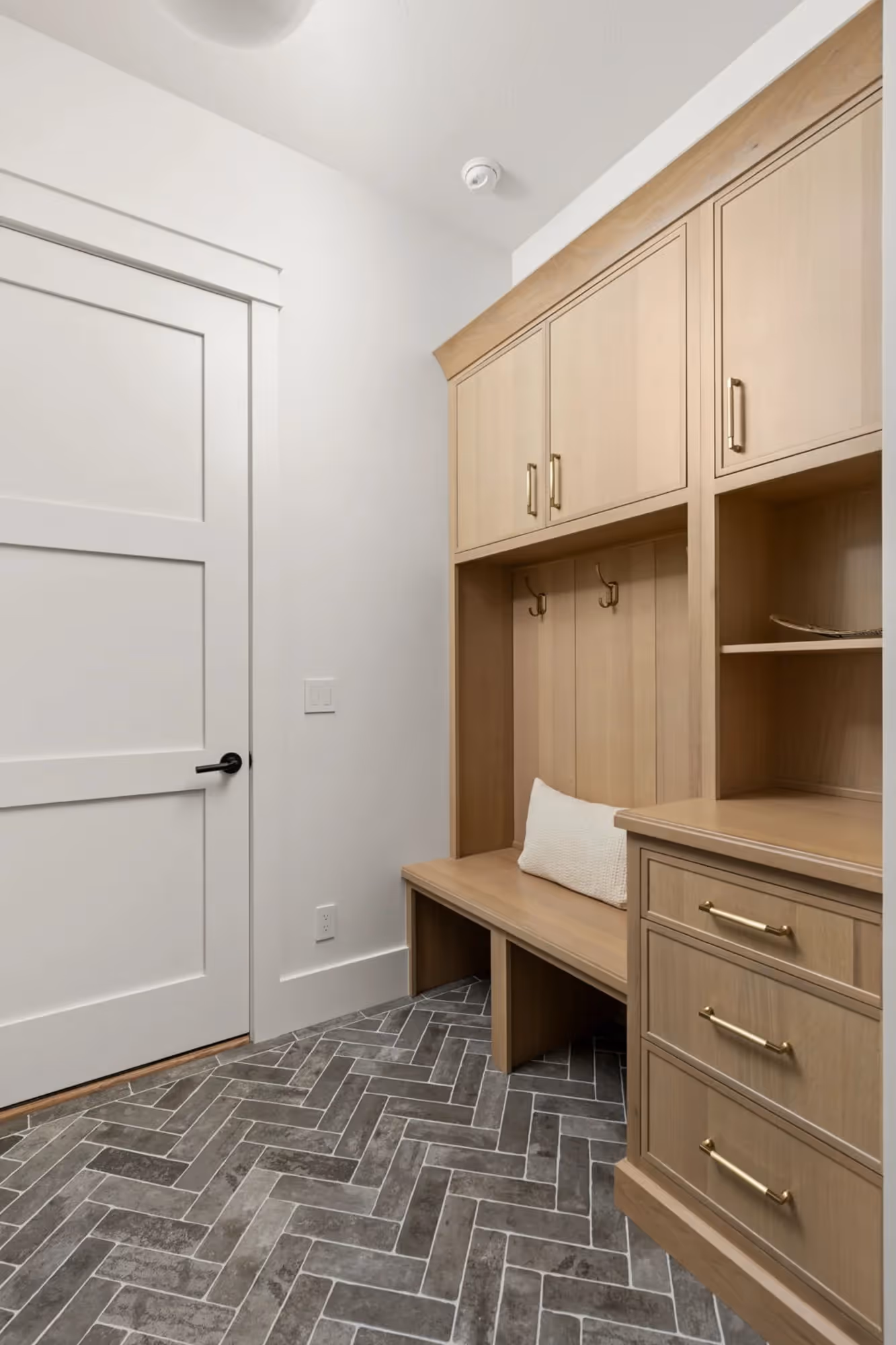 Built-in wooden workspace with desk and storage shelves