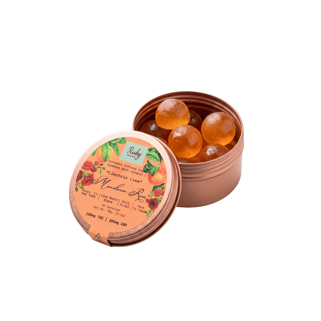 Open tin of Ruby Farms elderberry sage cannabis-infused vegan gummies with red round gummies inside.
