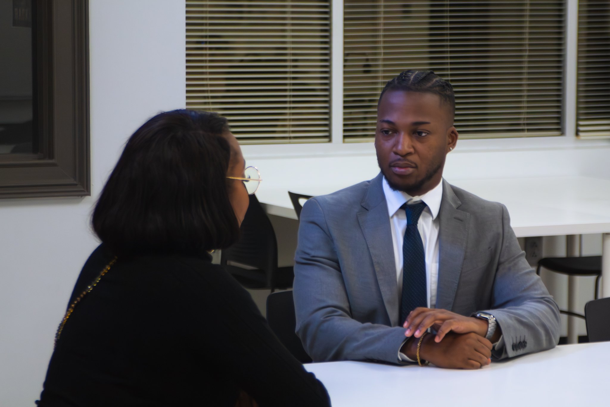 Hoston helps a health insurance client at the Augusta office