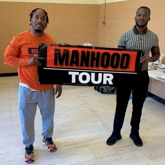 Hoston Fannings and David Mew, highlighting the partnership between Hoston Helps and The Manhood & Womanhood Tour