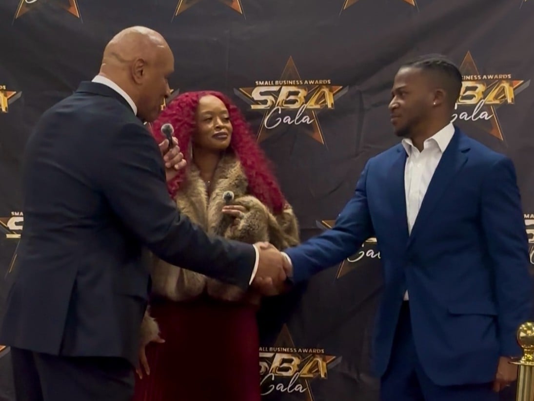 Hoston shakes hands with Sheriff Eugene Brantley