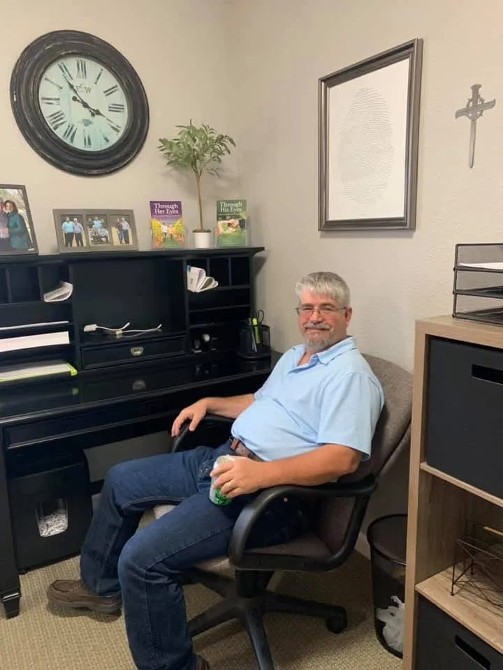 Dr. David Morrow sitting in his office at the first Olive Tree Family Counseling location