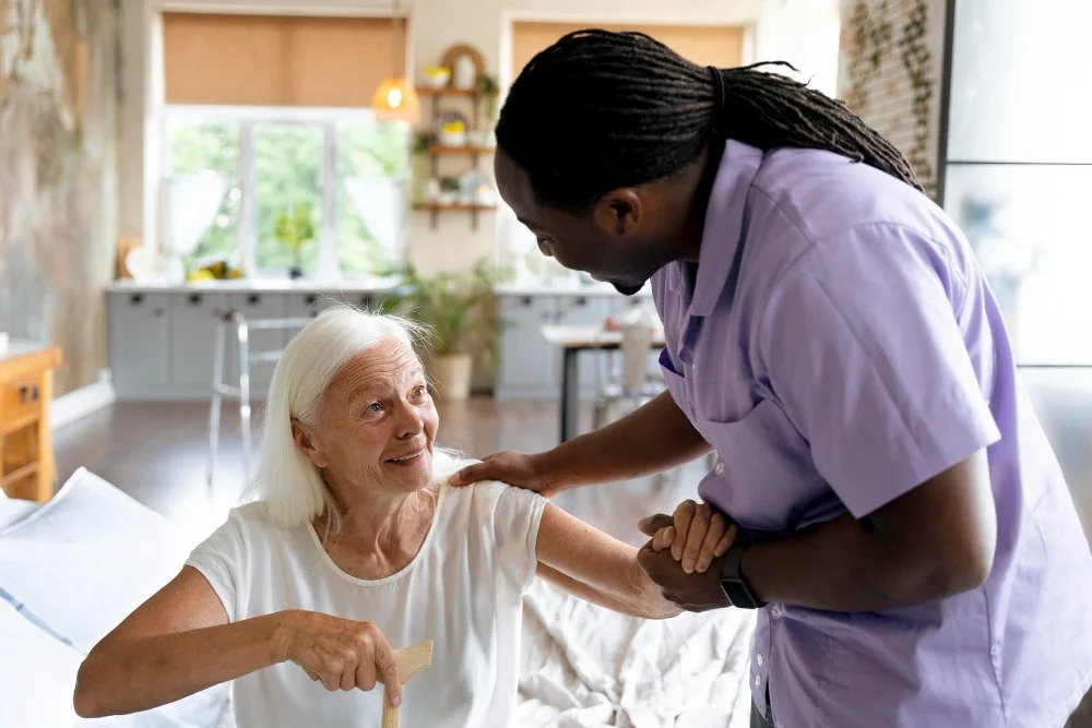Careworker helping an elderly woman