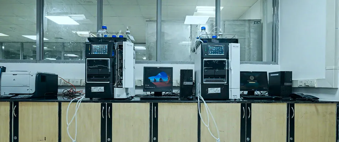 Black and white laboratory equipment setup for pharmaceutical research