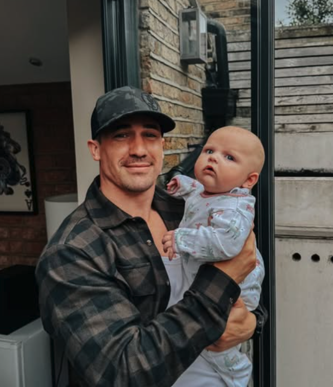 a man holding a baby