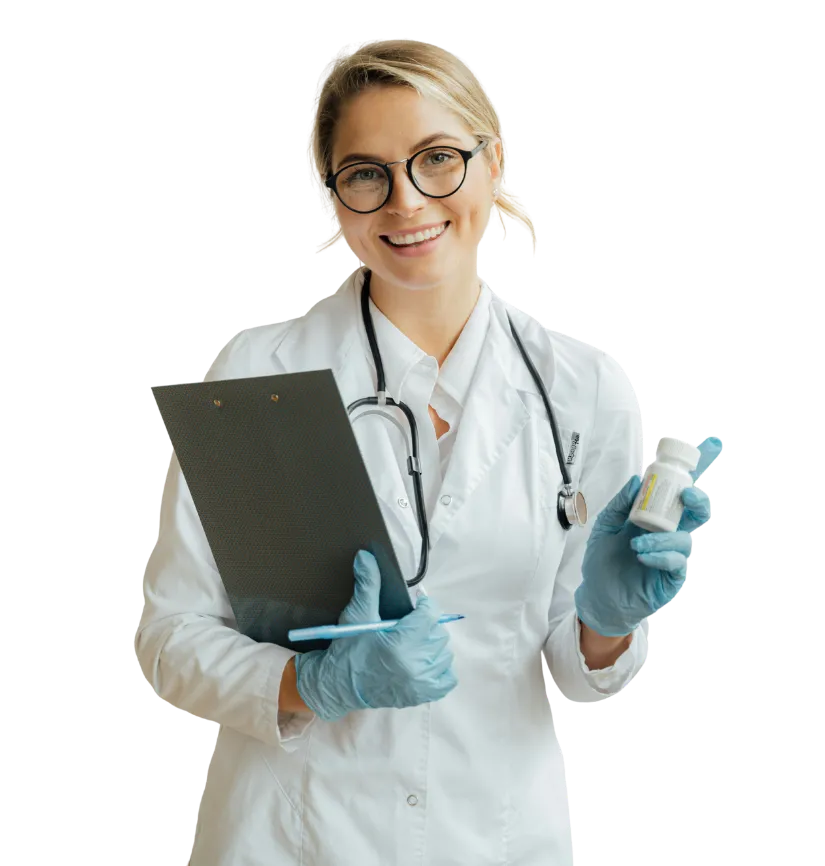 Smiling female doctor in white coat with stethoscope, holding a clipboard and a medicine bottle while wearing blue gloves.