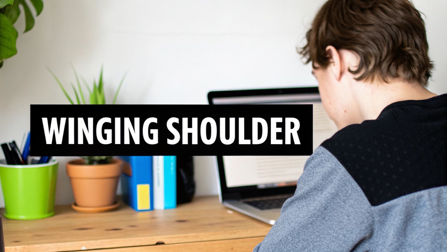 A person views a laptop on a wooden desk with plants and books, overlaid with text 'WINGING SHOULDER'.