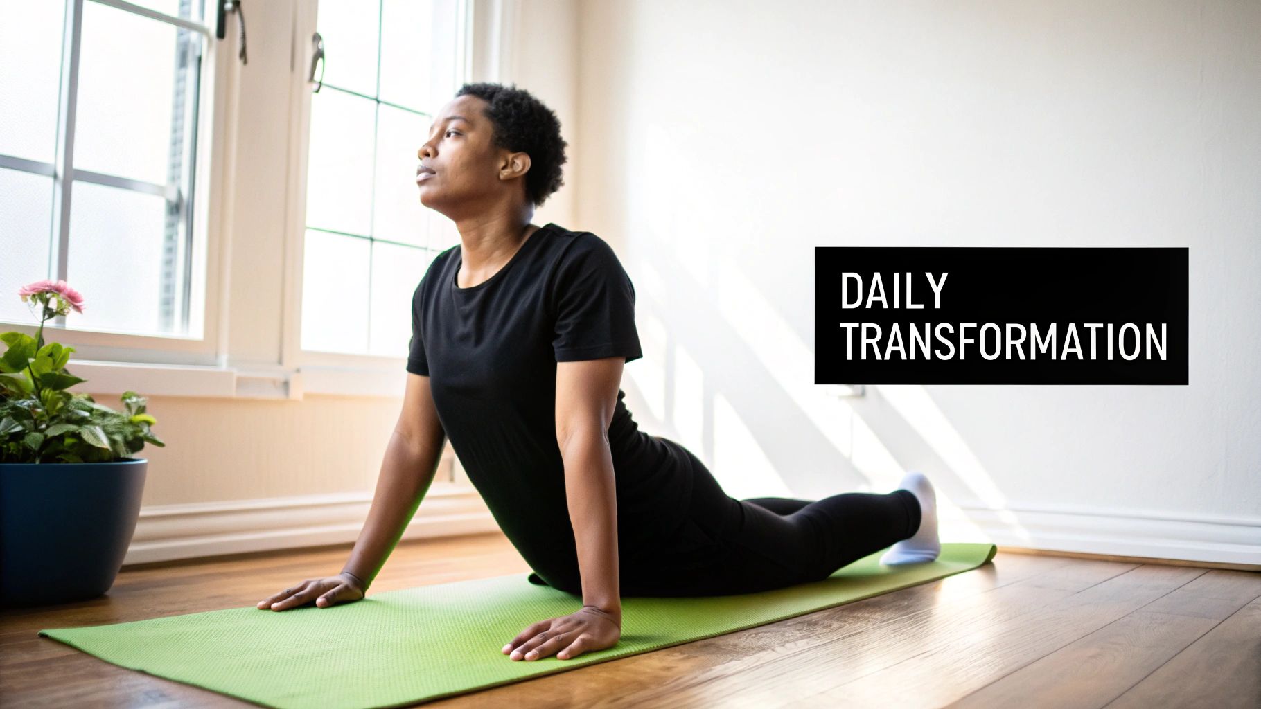 Woman performing upward facing dog yoga pose on green mat in bright studio