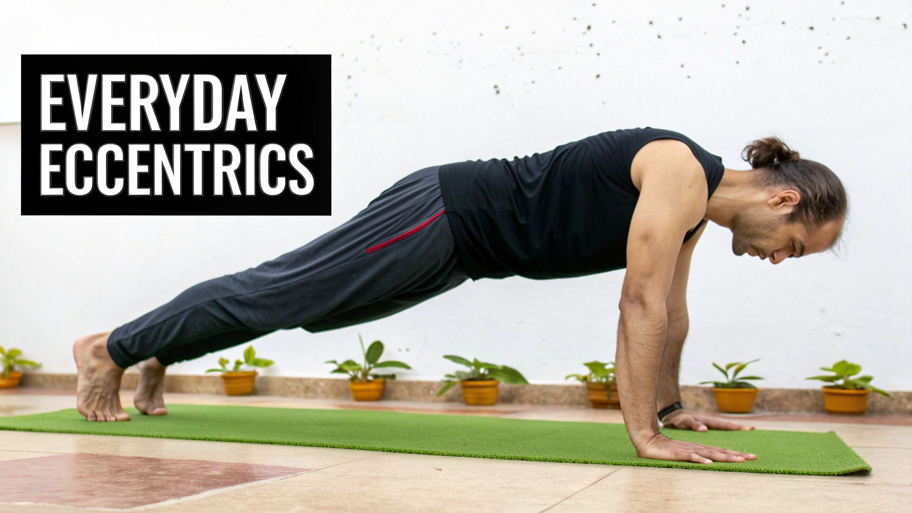 A man holds a plank pose on a green yoga mat, illustrating everyday eccentric exercise.
