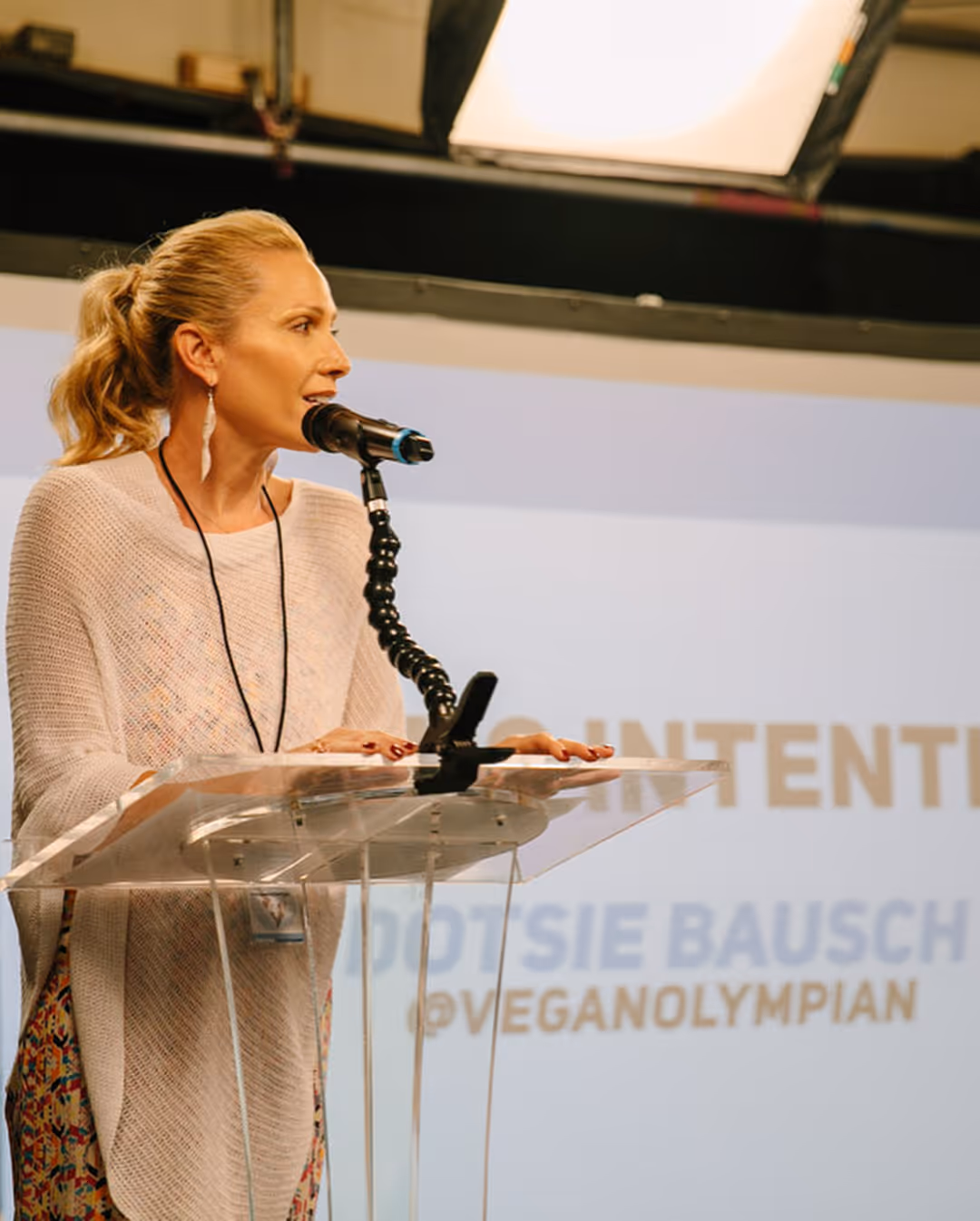 Switch4Good co-founder Dotsie Bausch speaking at the brand's Athlete Summit