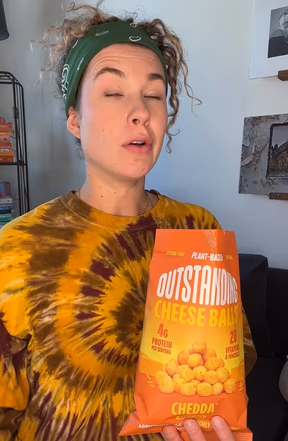 Young girl holding snacks