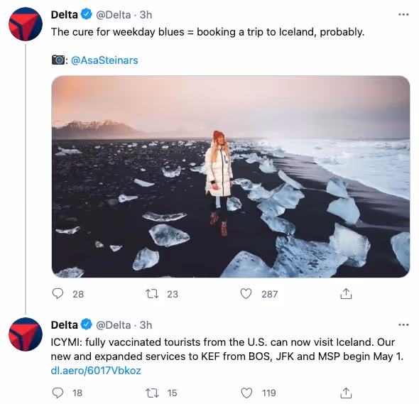 A screenshot from Delta's Twitter account ft. UGC of a woman standing on a cold, black beach in Iceland – with small glaciers surrounding her