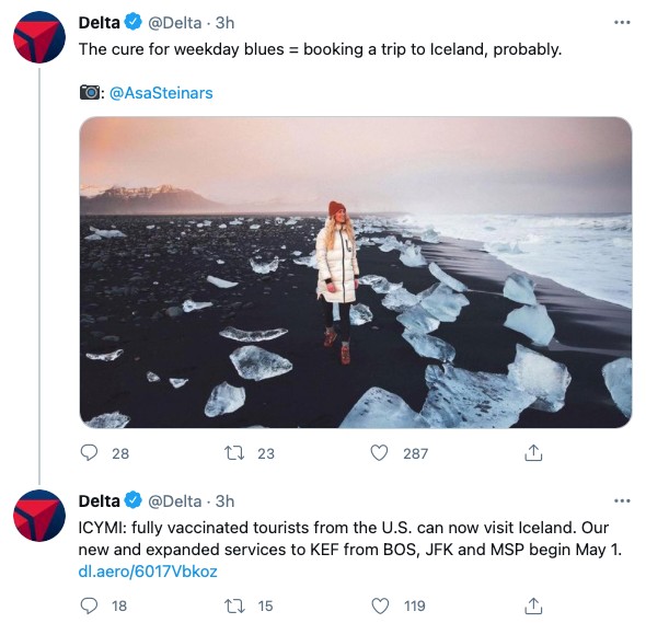 A screenshot from Delta's Twitter account ft. UGC of a woman standing on a cold, black beach in Iceland – with small glaciers surrounding her 