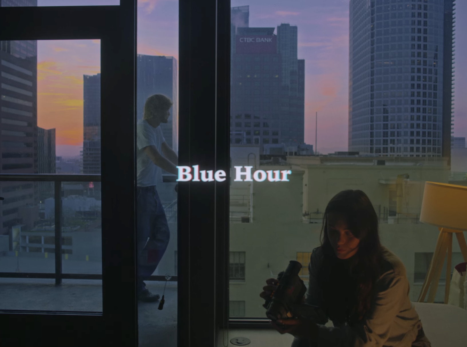 A distant couples sharing a moment in their apartment in downtown los angeles