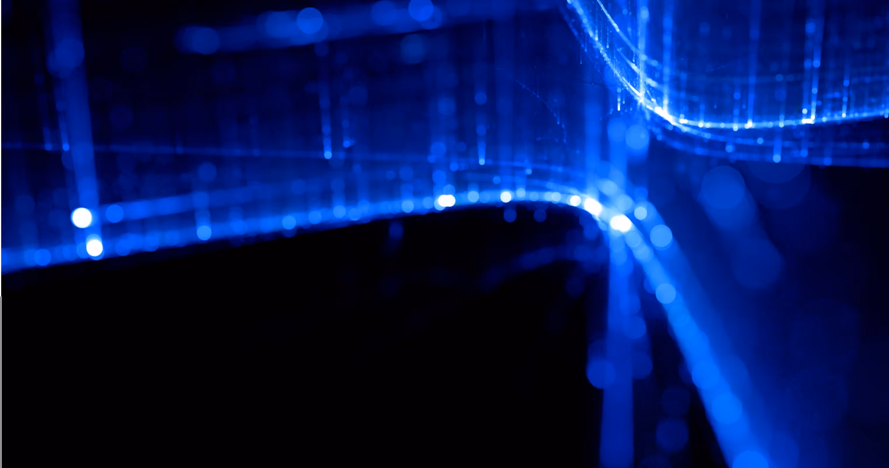 Abstract digital blue light lines and dots forming a futuristic network pattern on a black background.