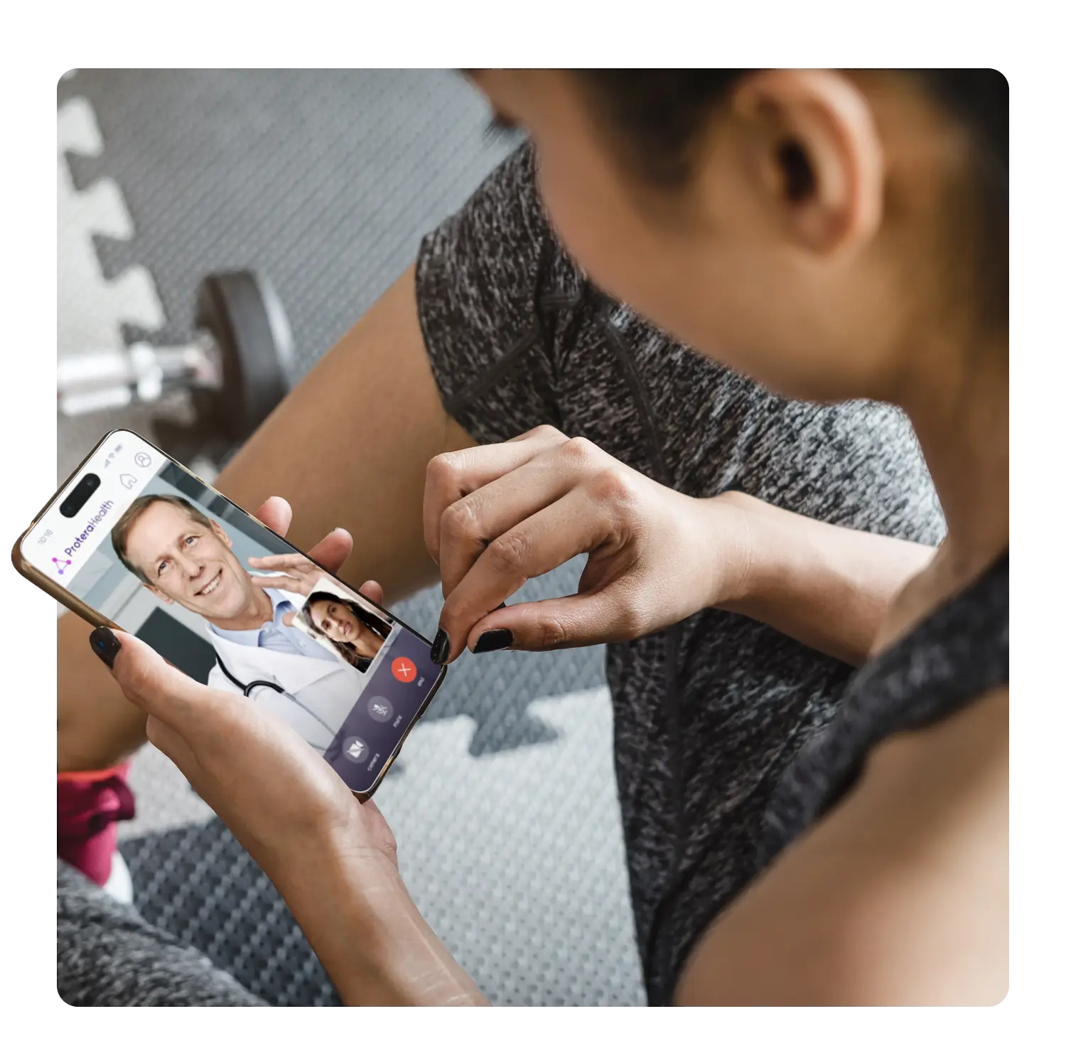 woman in fitness clothing looking at a cellphone