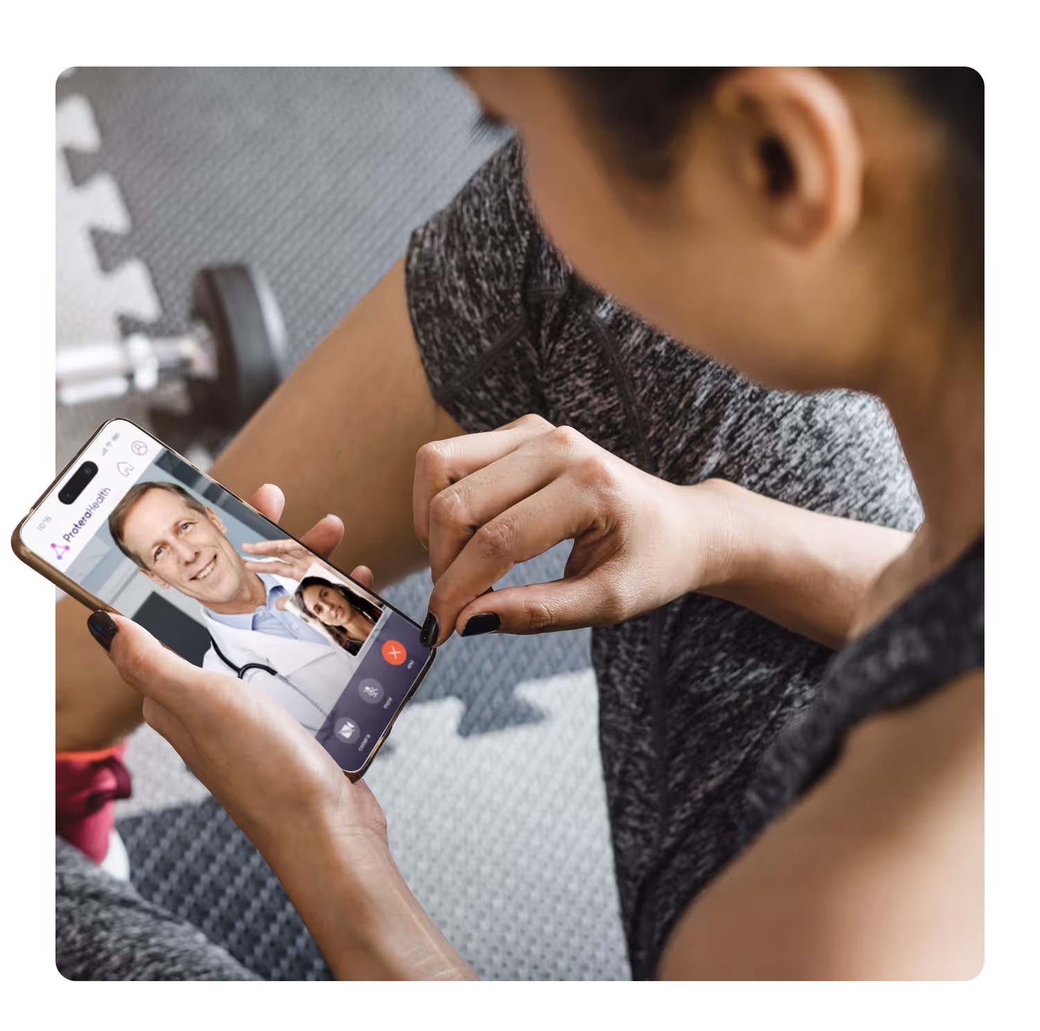woman in fitness clothing looking at a cellphone