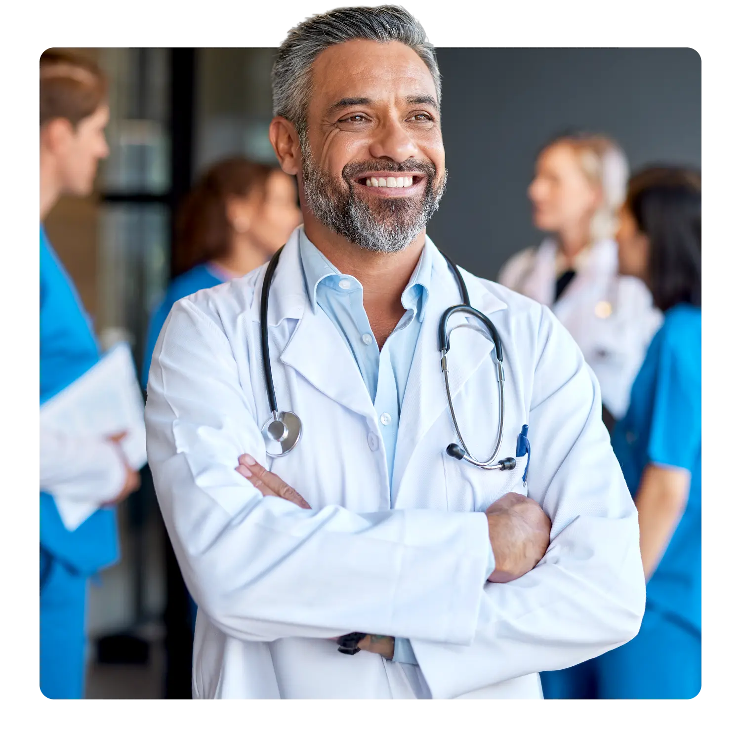 Doctor standing in front of a health team