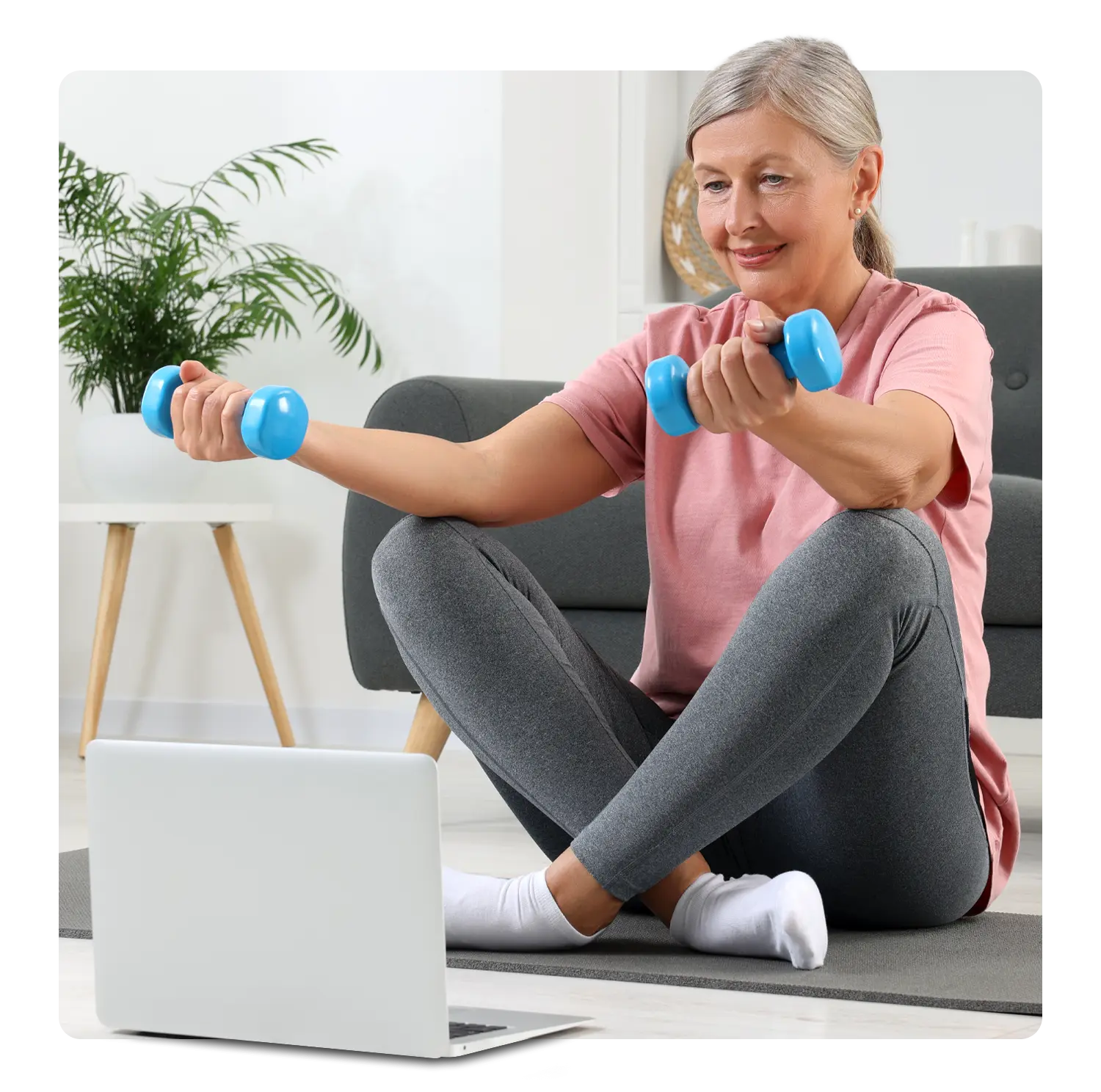 Middle-age woman working out at home
