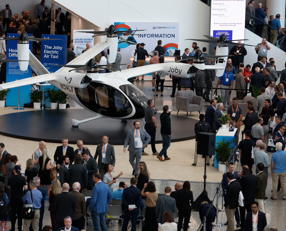 Crowded event showcasing the Joby electric air taxi displayed at the LVCC at the 2025 NBAA-BACE