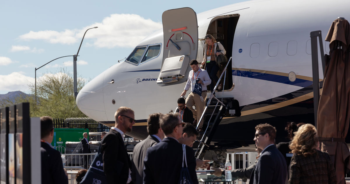 NBAA-BACE attendees on a crowded exhibit floor