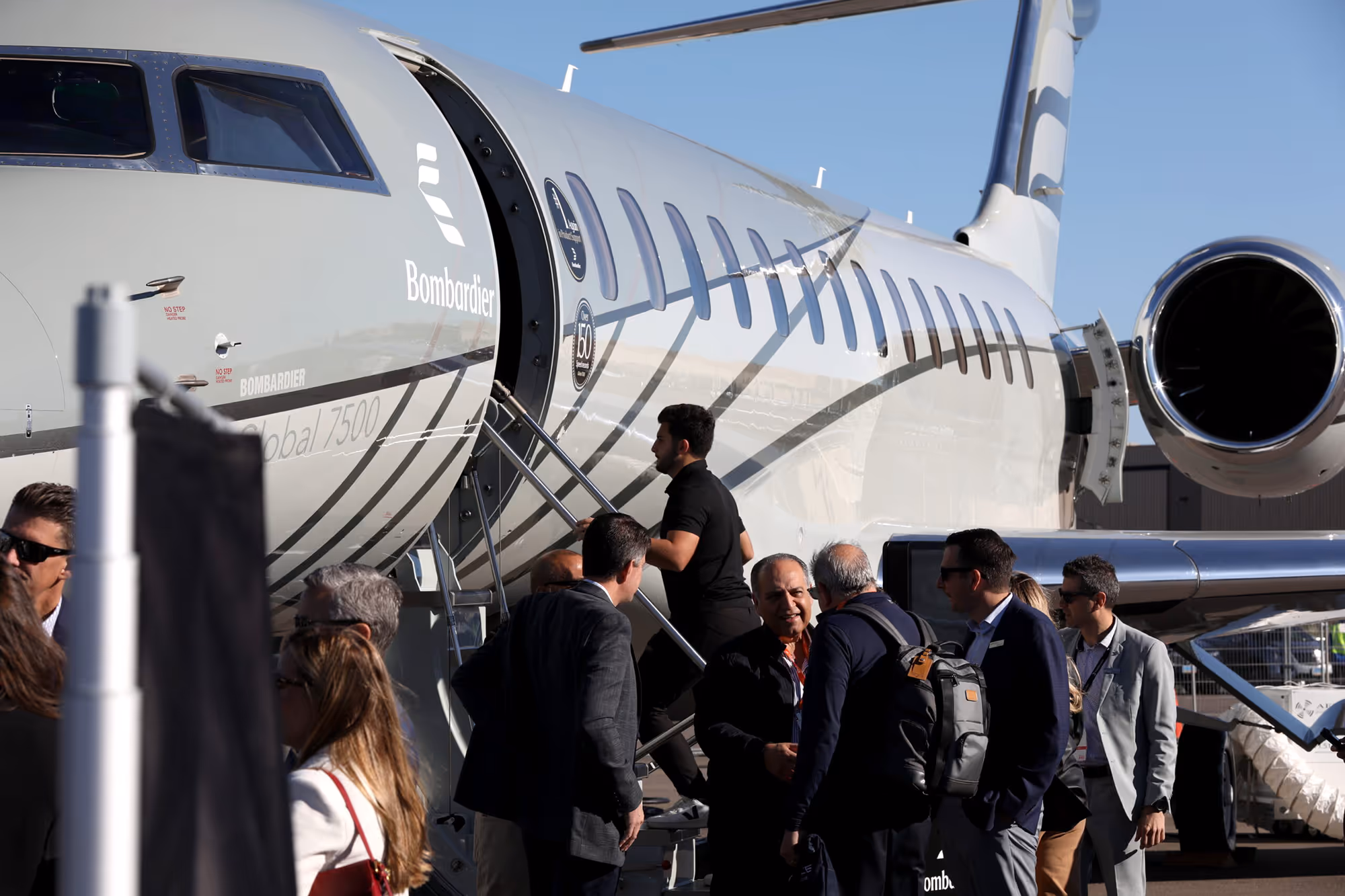 People boarding a Bombardier Global 7500 jet at the 2025 Aircraft Connection's display of aircraft
