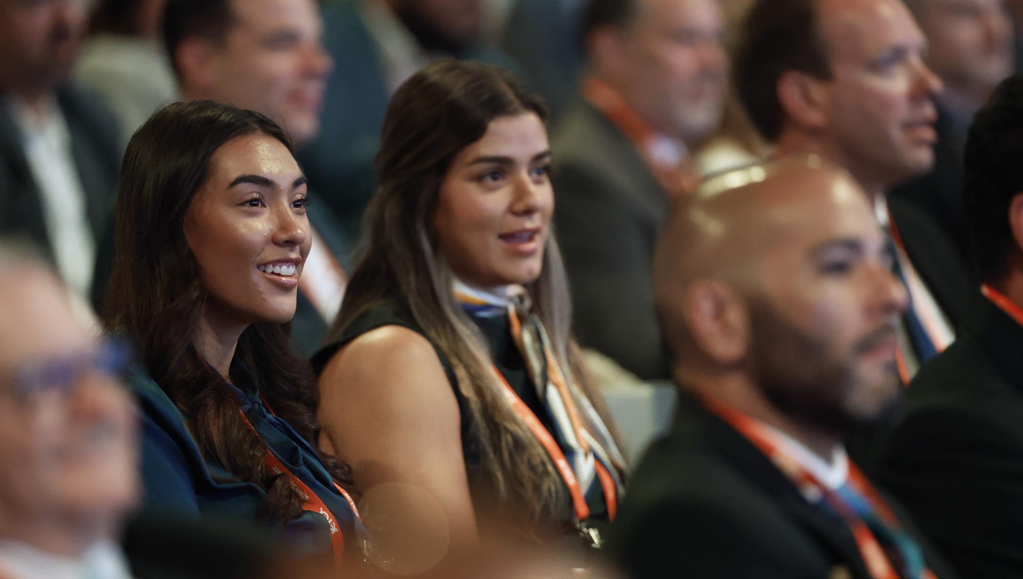 Audience members listening to an education session.