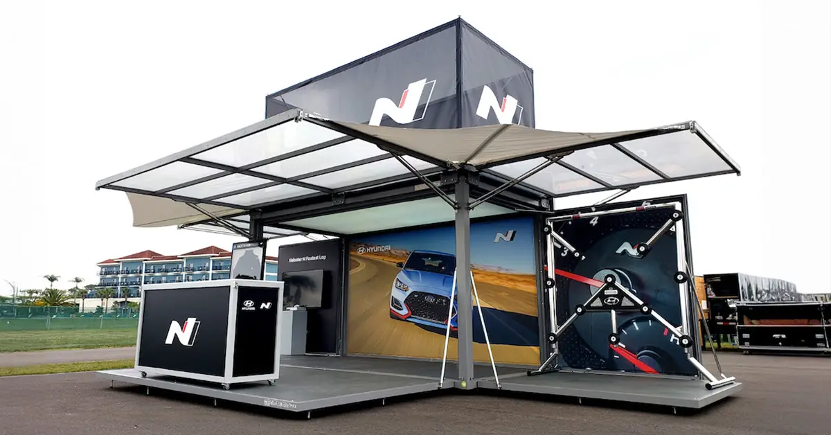 Highmark TechSystems branded hospitality container with canopy and graphics of a car and speedometer