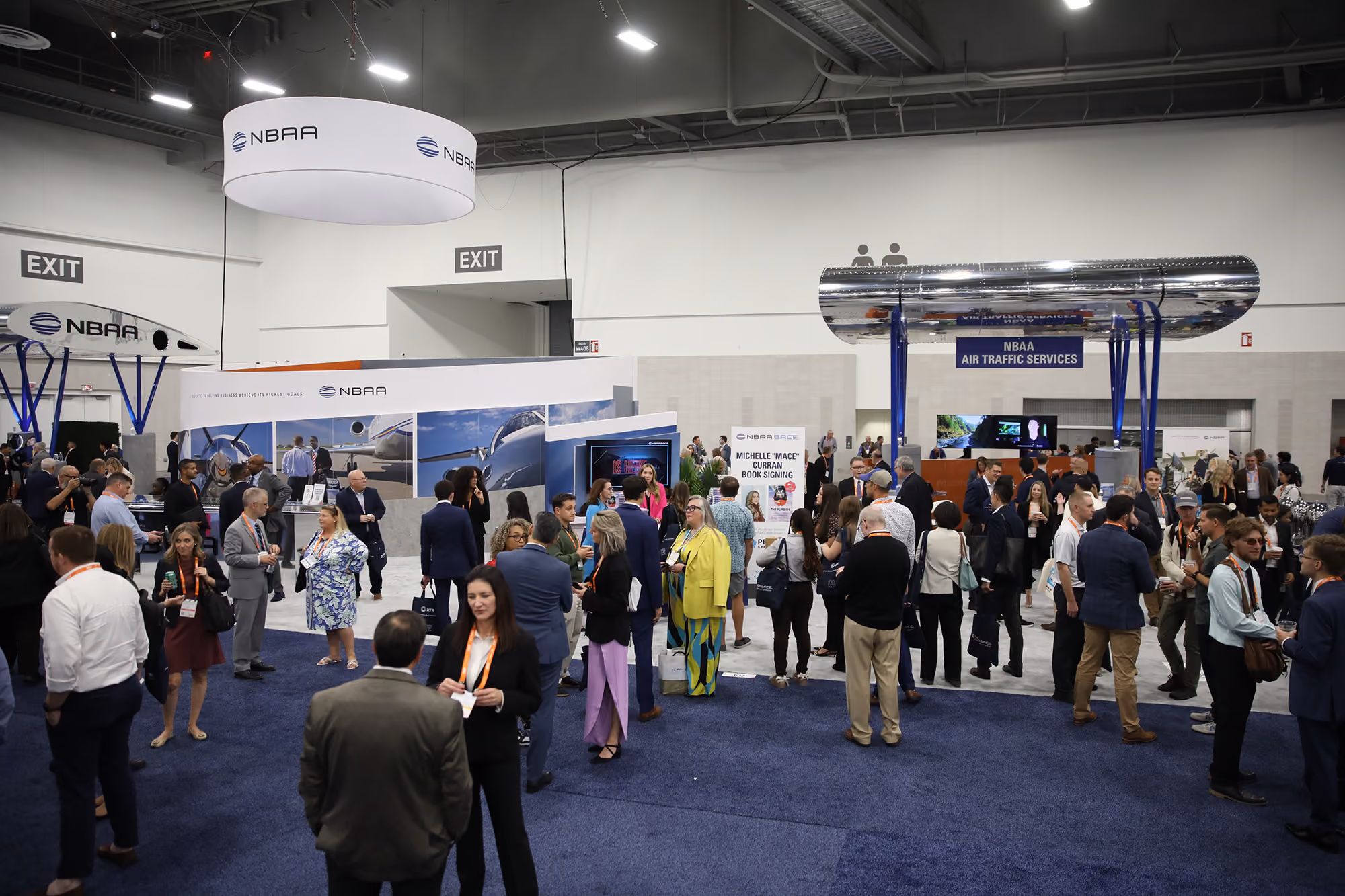 Crowds of attendees at NBAA's booth during the 2025 NBAA-BACE Coffe Social