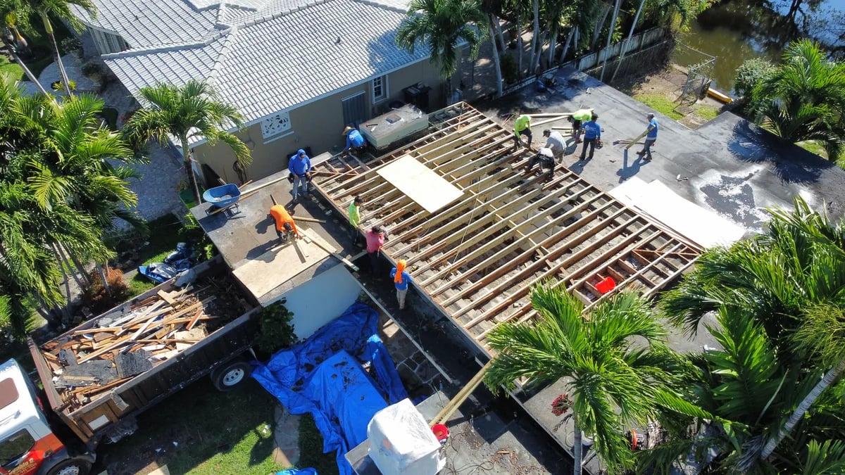 Roofing contractor performing careful detail work on installation