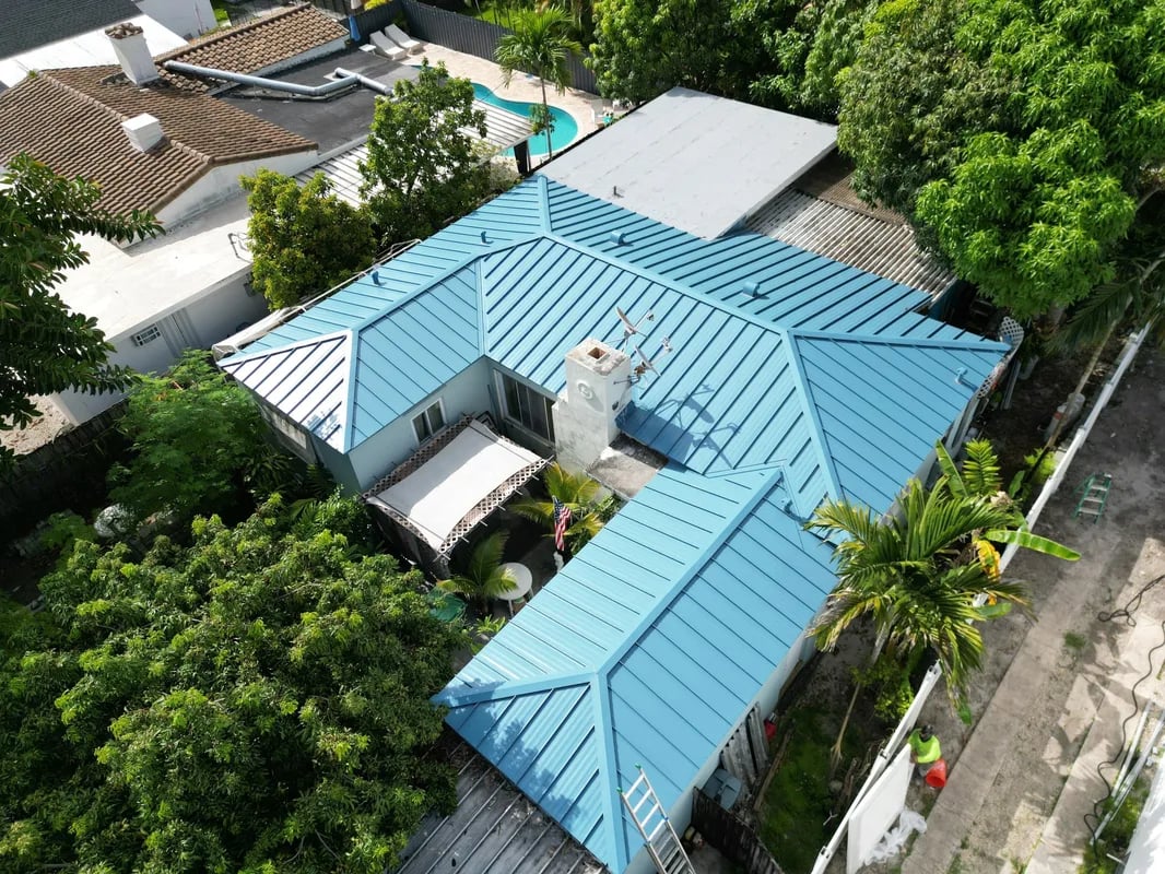 Standing seam metal roof installation on a Miami residential property