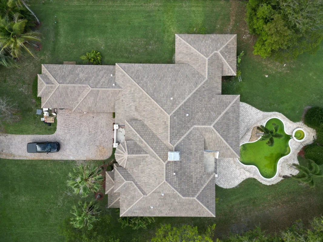 Professional roofing consultation with South Florida homeowner