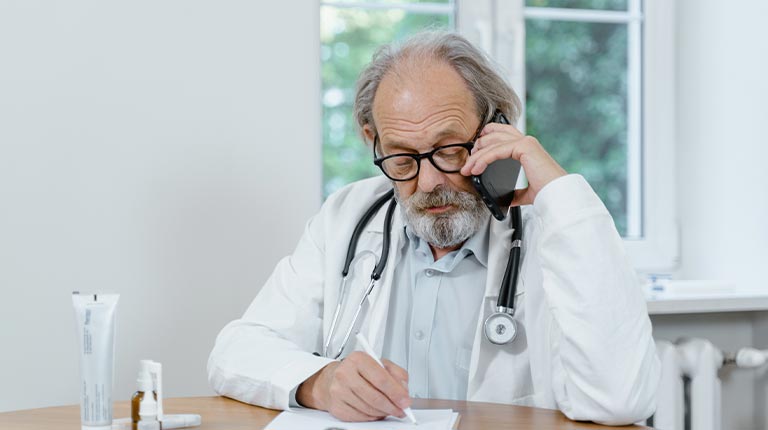 A doctor using a phone