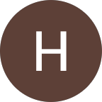 White uppercase letter H centered on a dark brown circular background.
