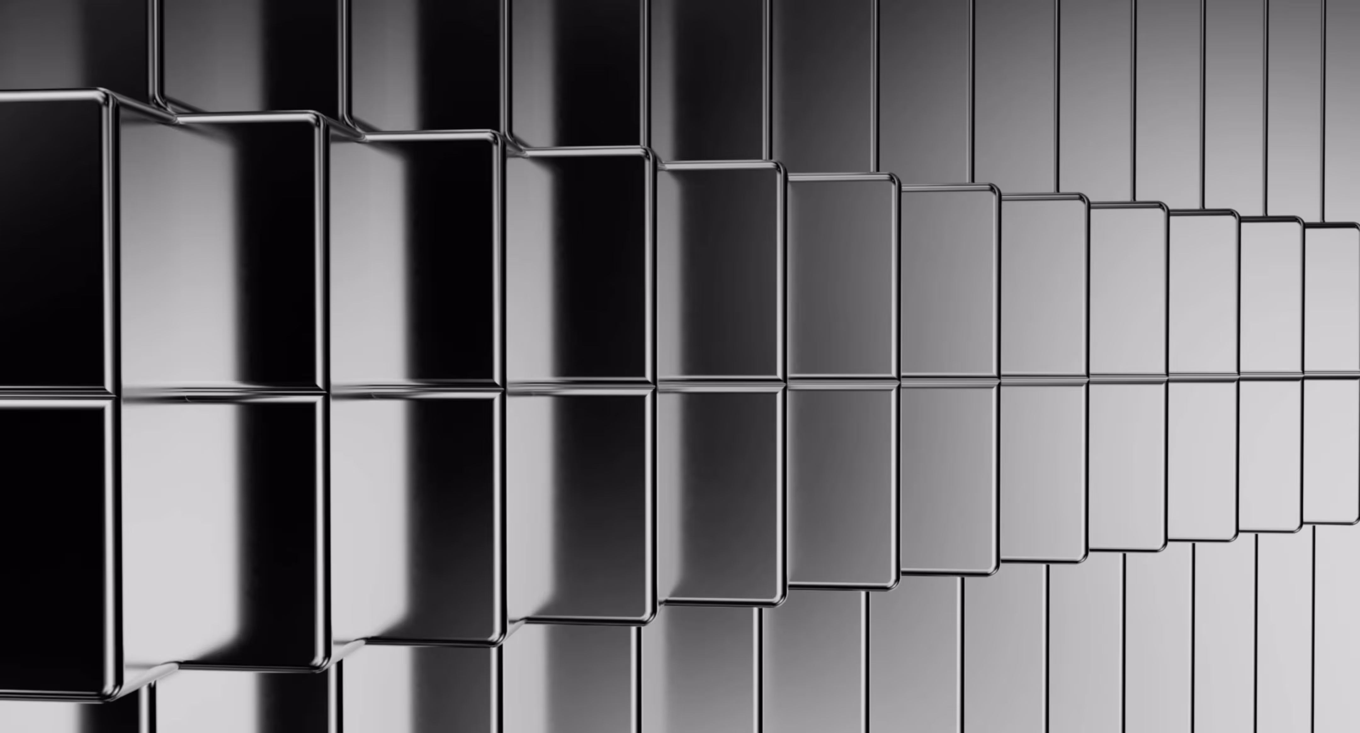 Rows of reflective black rectangular blocks creating a stepped pattern in grayscale.