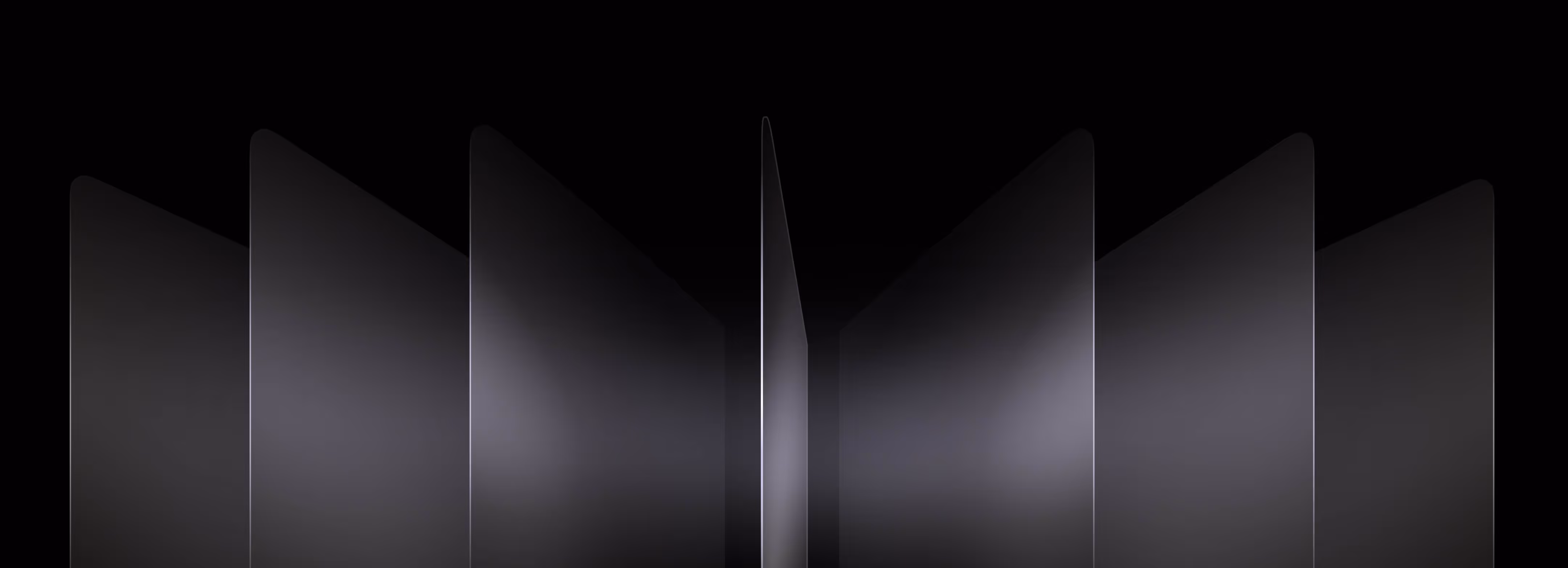 Several semi-transparent black panels arranged in a symmetrical pattern on a dark background.